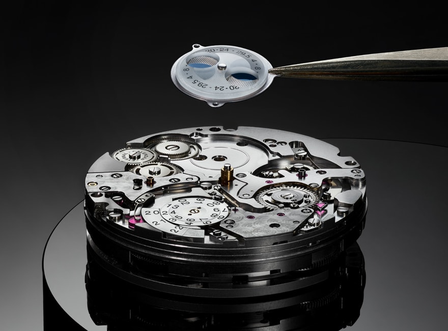 A close up of assembling a watch