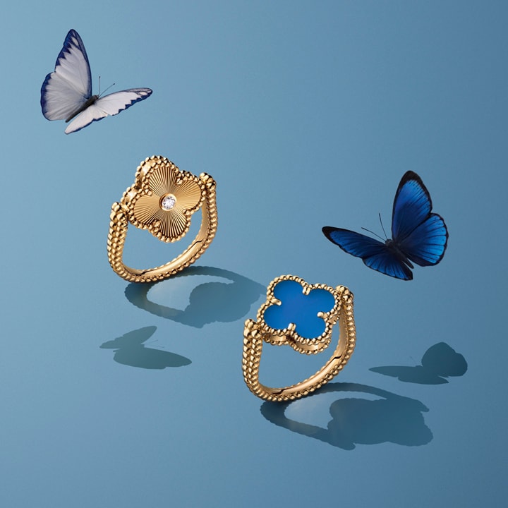 Two golden rings and butterflies flying over