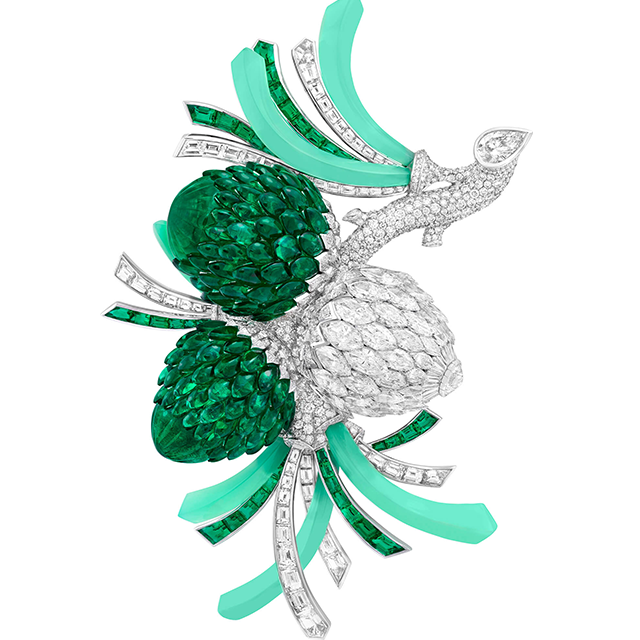 The Pomme de Pin clip, pinecones poised on a diamond branch budding with young shoots